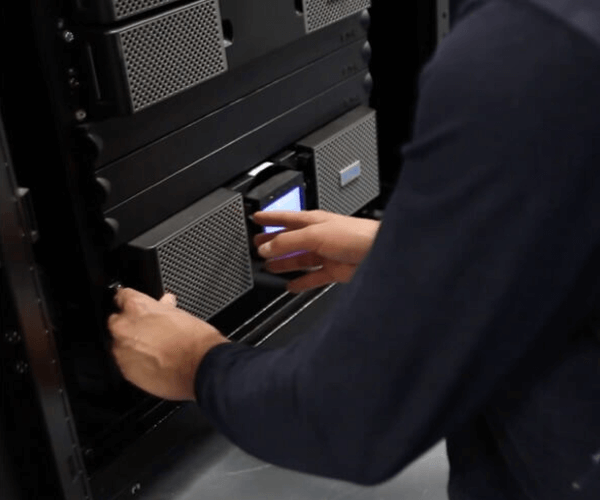 image: person installing a UPS