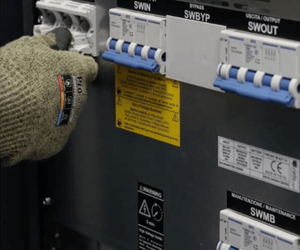 image: person switching on circuit breakers